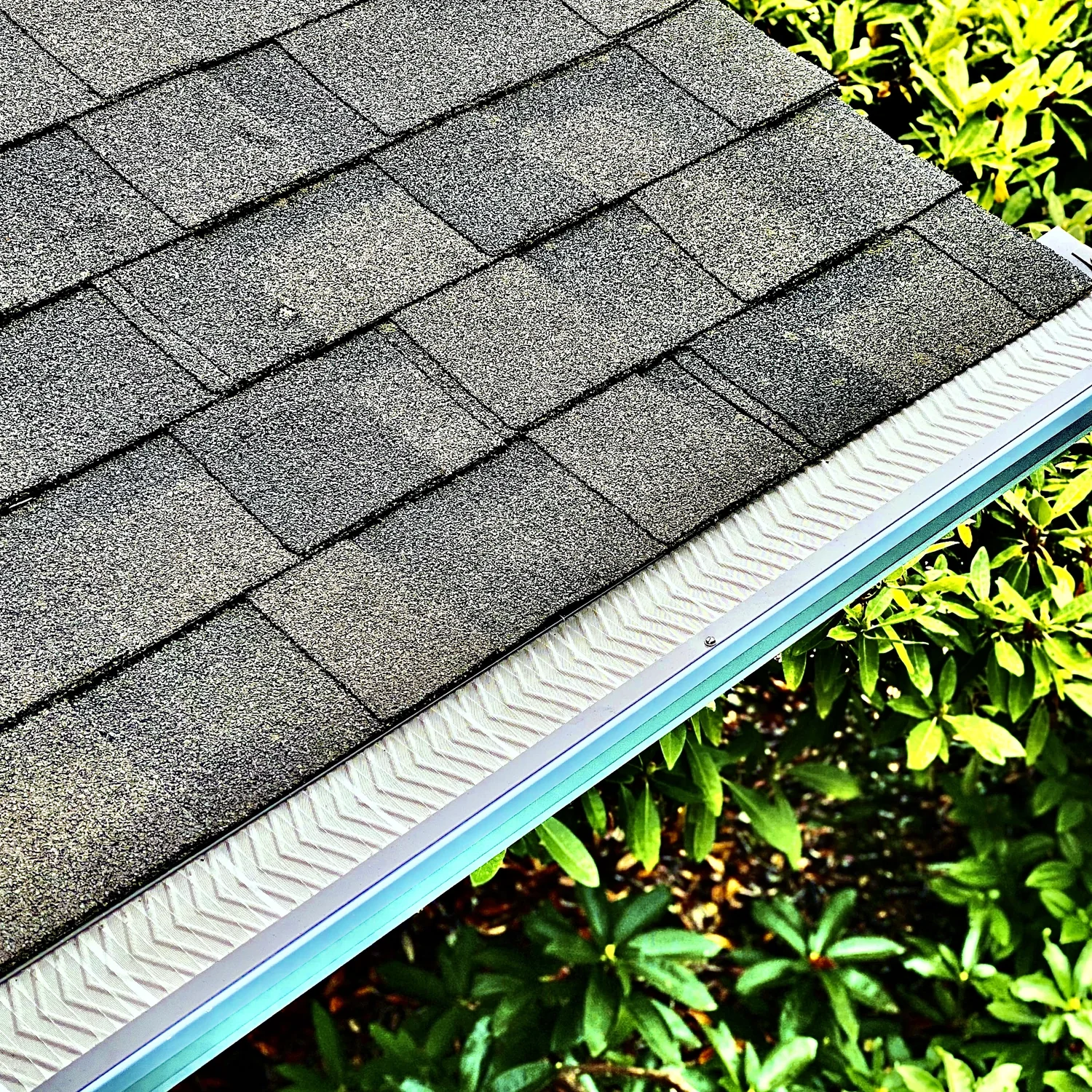 Copper downspout with conductor head and river rock siding, Camas WA