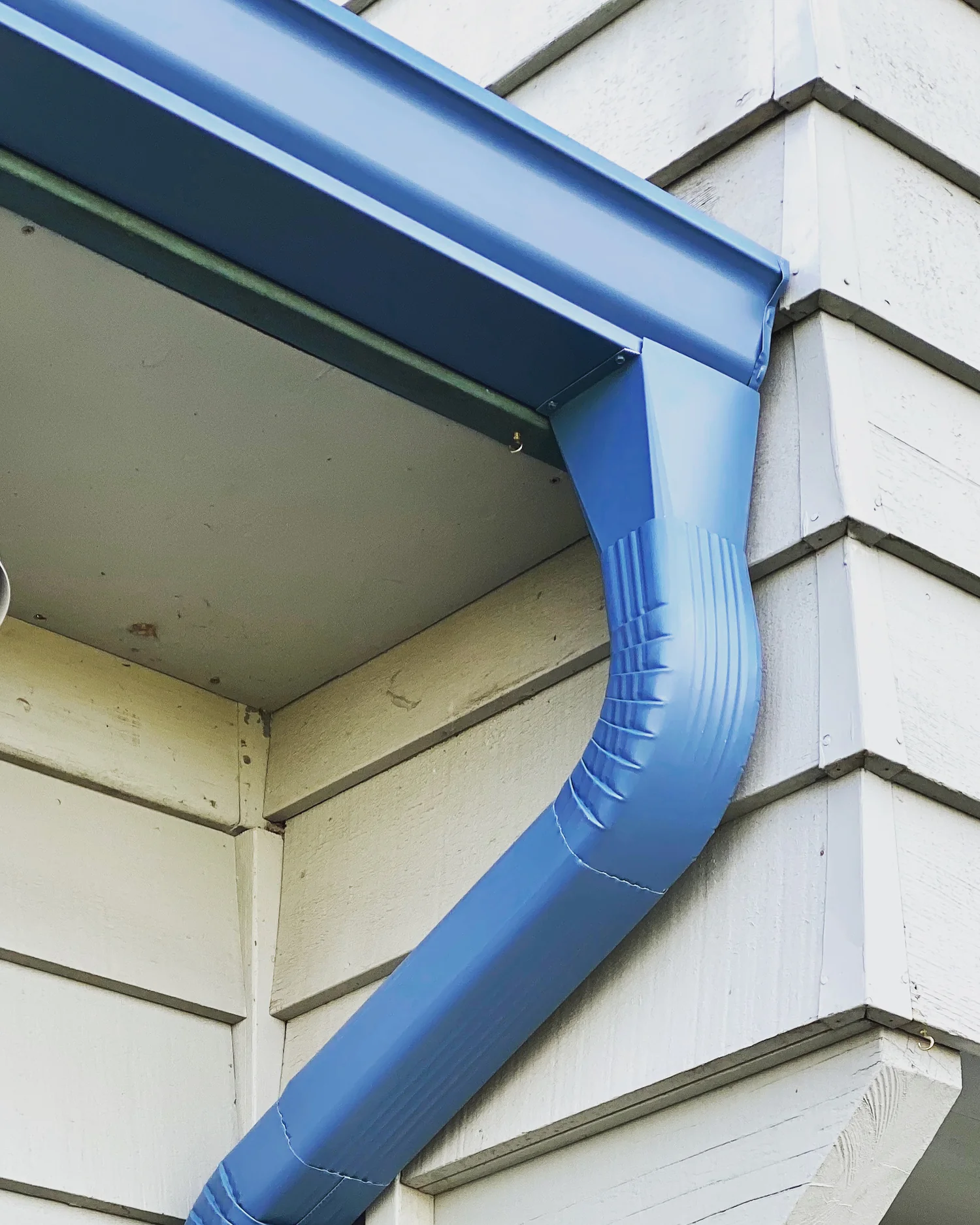 Copper downspout with conductor head and river rock siding, Hazel Dell WA area