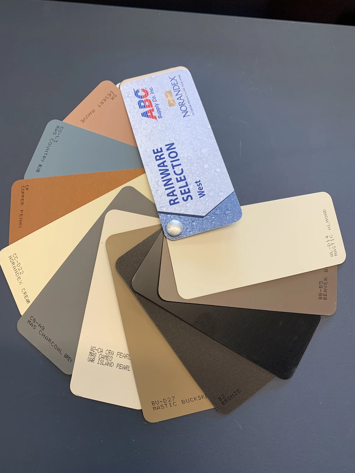 Green downspout and brick porch residential elbow, Vancouver WA